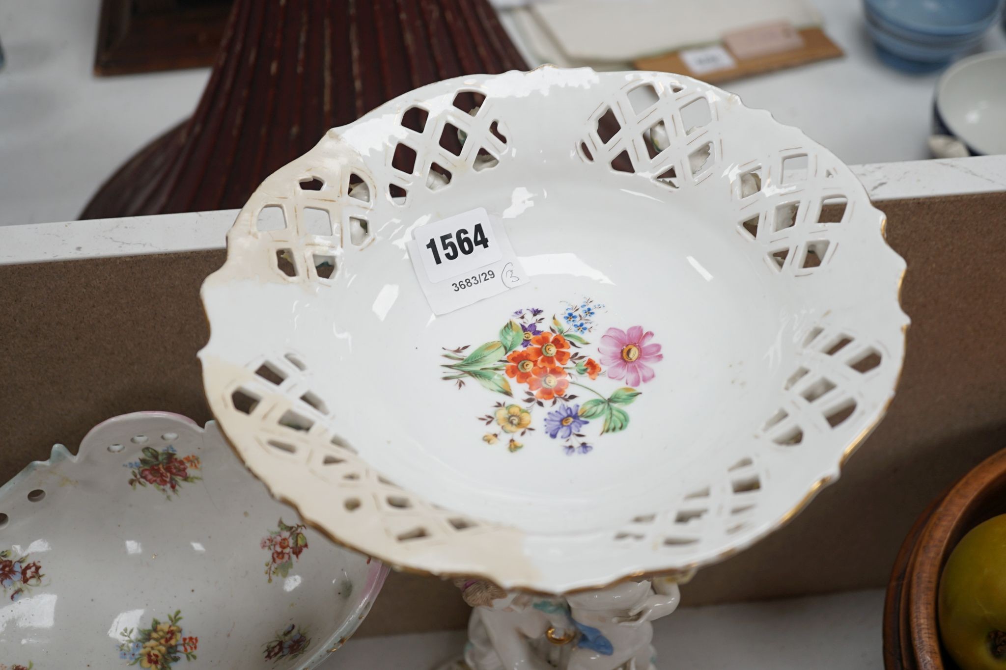 A tall German porcelain figural centrepiece bowl and two others smaller. Tallest 47cm